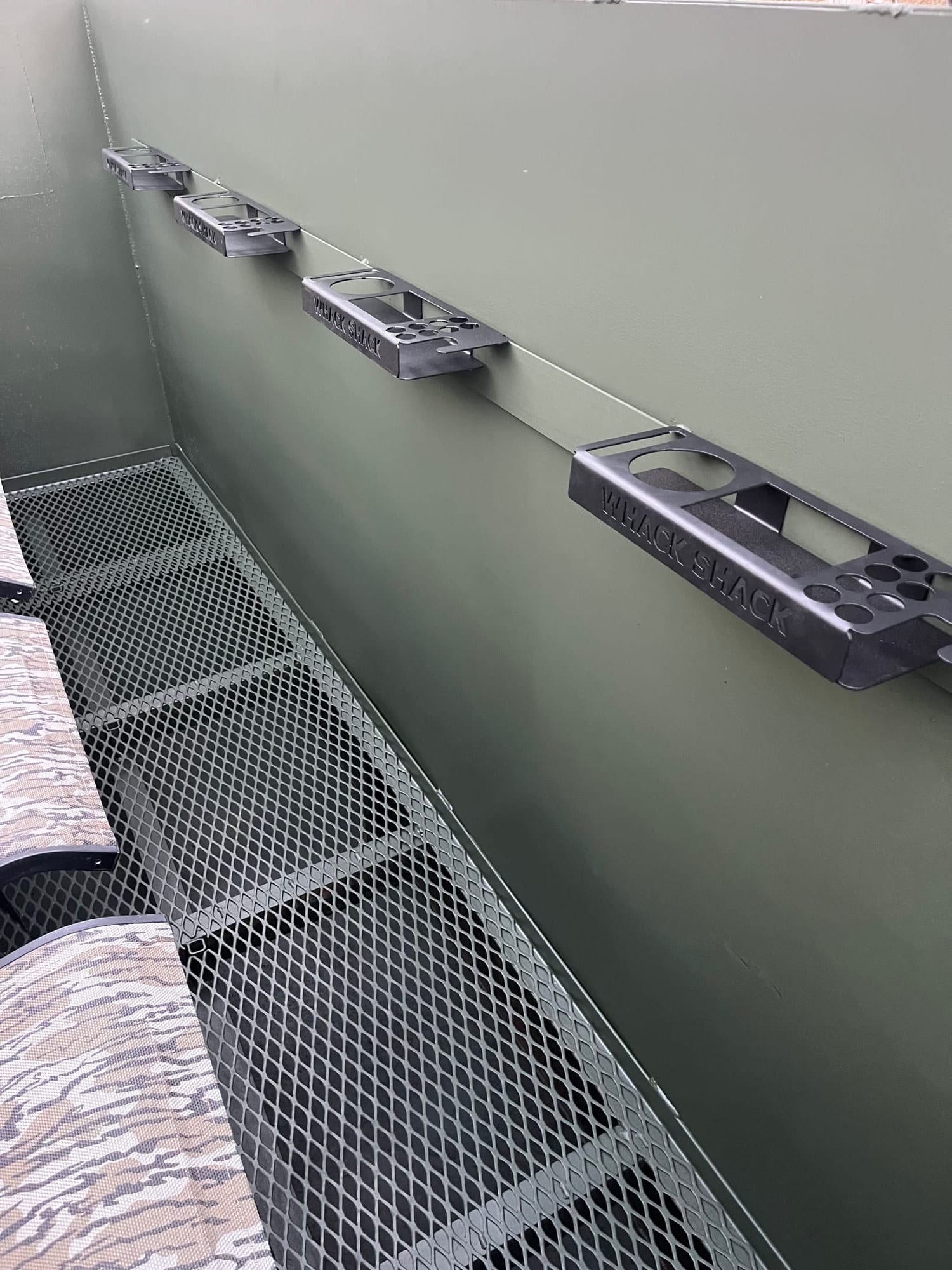 Custom plasma-cut Whack Shack gun rack detail inside pit blind