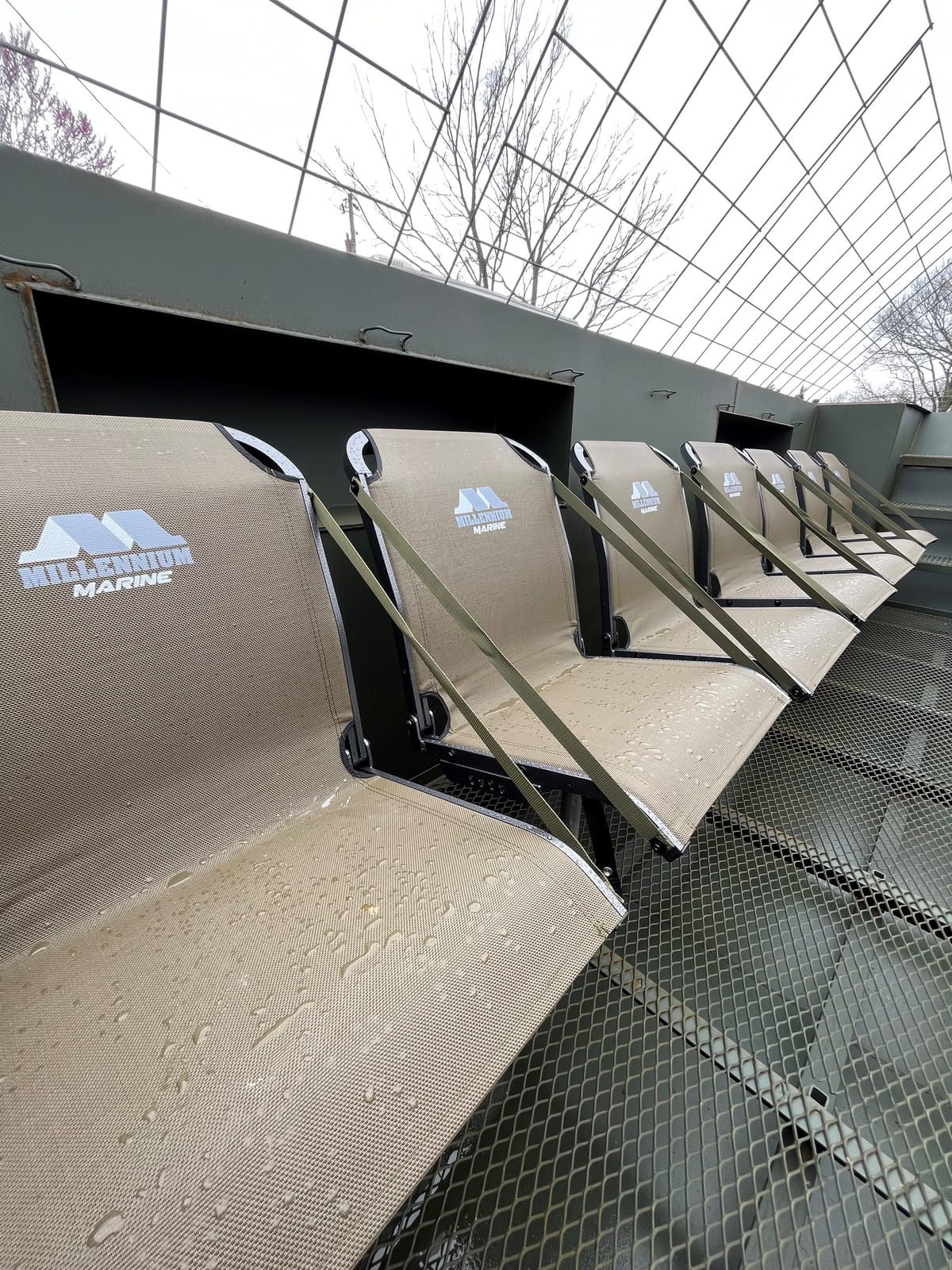 Integrated fold-down seating inside a steel pit blind