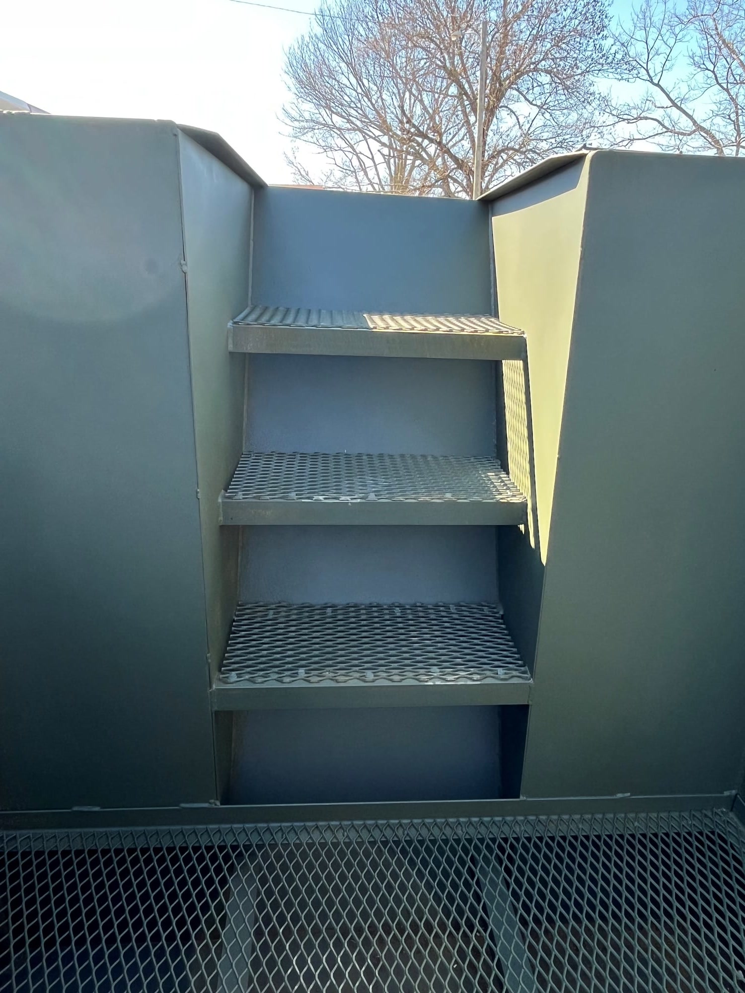 Entry stairs into a custom steel pit blind
