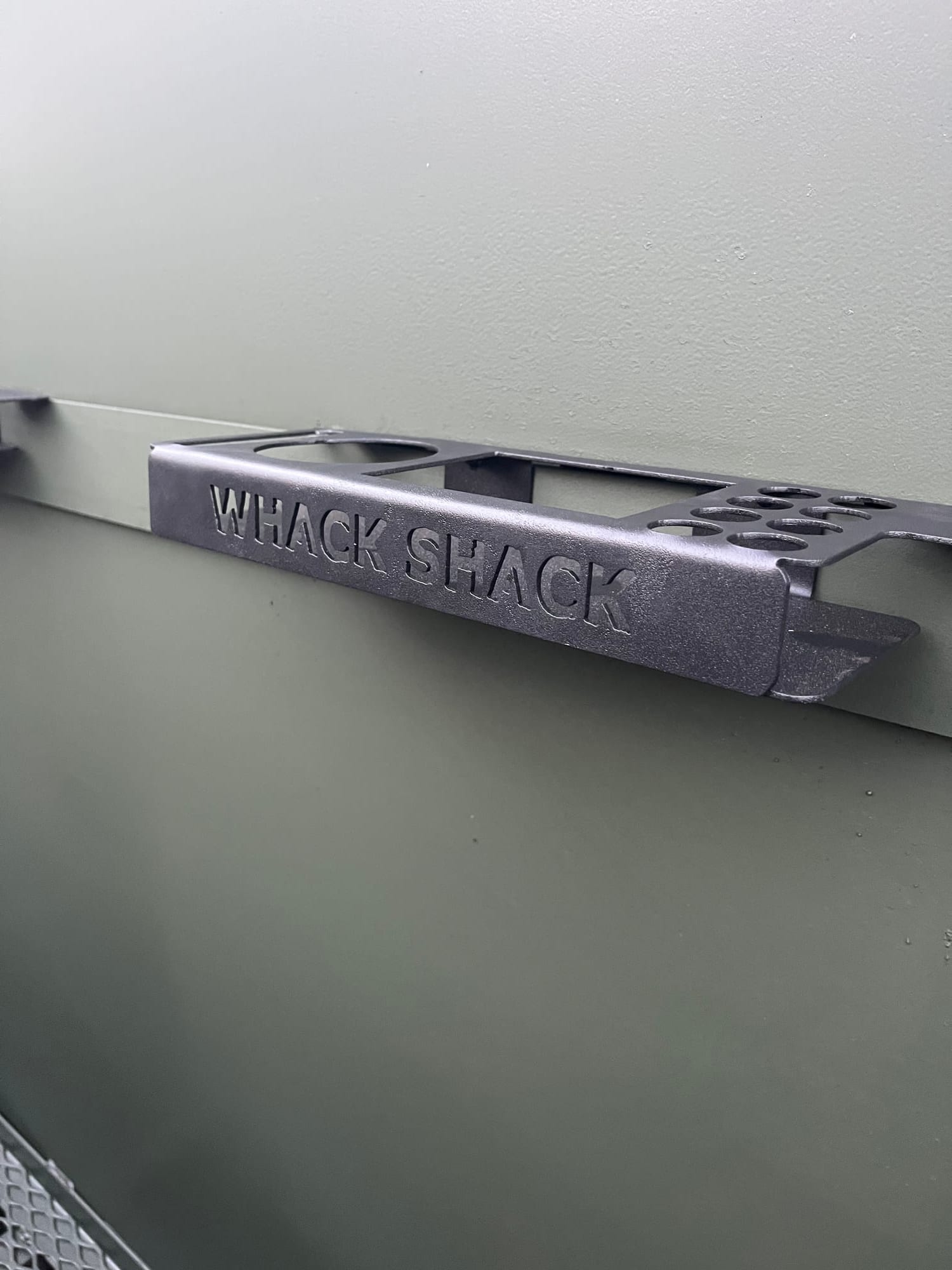 Whack Shack branded steel handle detail on a duck blind