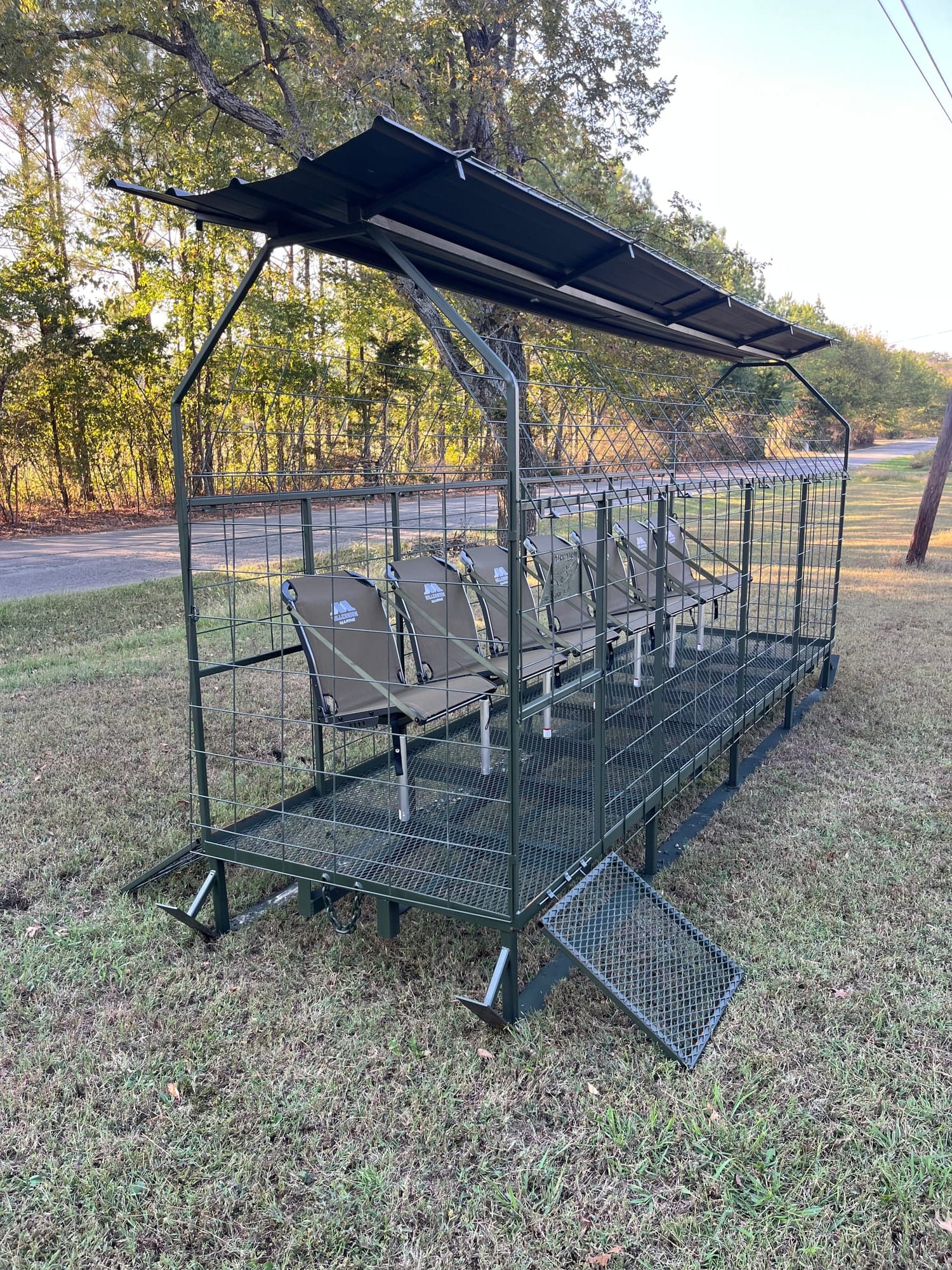 Skid blind angled view showing steel frame and fold-down seats